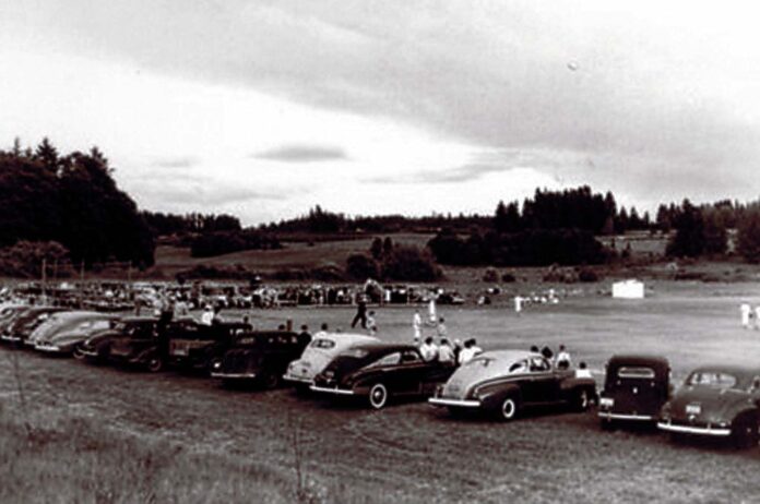 Tualatin-Town-Baseball-game Everybody for miles around would come to watch the Tualatin Town Team play baseball games on an open field along Nyberg Road. The white building on the right was the rest room facility. Hervin Company later developed this area into a pet food manufacturing plant.