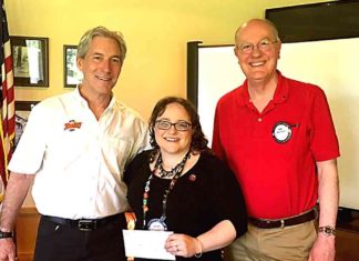 Tualatin Rotary Club Supports Unique Cafe Daniel Lacy (left) accepts Tualatin Rotary Club Legacy Grant from Jessica Cousineau and Mike Bunce.
