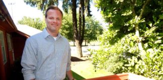 Tualatin Park and Rec asks for your input New City of Tualatin Parks & Recreation Director Ross Hoover stands on the porch of his office building in Tualatin Community Park with the skate park and ball fields in the background. Photo: Barbara Sherman