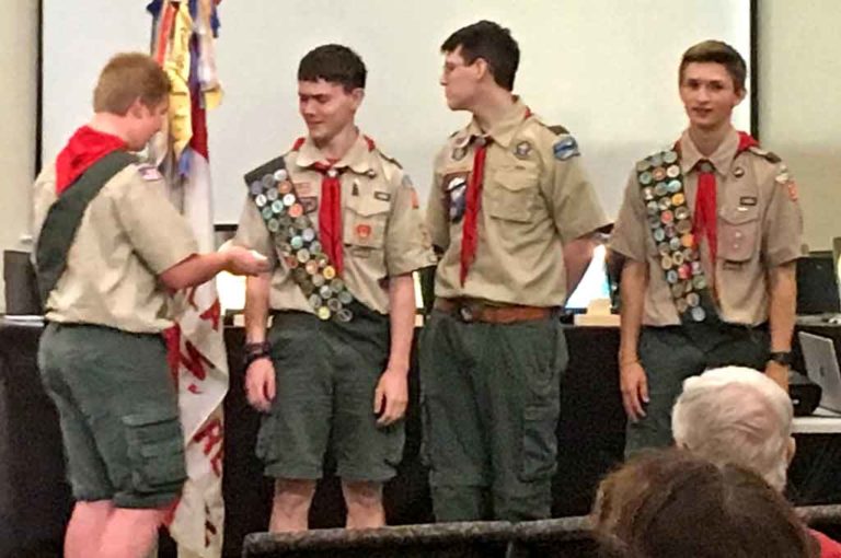 Mason Lewellan presents three Eagle Scouts earn their Silver Palms (recognition for leadership beyond the Eagle Scout rank): Matthew Dannemiller, Liam Davis, and Devin Boatsman.