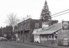 A Tribute to Mayor Lou Ogden Intersection Boones Ferry and Tualatin Rd. Brick store, old Post Office, Mae’s Cafe, Bonk’s Shell. c. 1975.