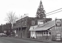 A Tribute to Mayor Lou Ogden Intersection Boones Ferry and Tualatin Rd. Brick store, old Post Office, Mae’s Cafe, Bonk’s Shell. c. 1975.