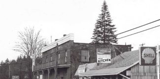 A Tribute to Mayor Lou Ogden Intersection Boones Ferry and Tualatin Rd. Brick store, old Post Office, Mae’s Cafe, Bonk’s Shell. c. 1975.