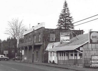 A Tribute to Mayor Lou Ogden Intersection Boones Ferry and Tualatin Rd. Brick store, old Post Office, Mae’s Cafe, Bonk’s Shell. c. 1975.