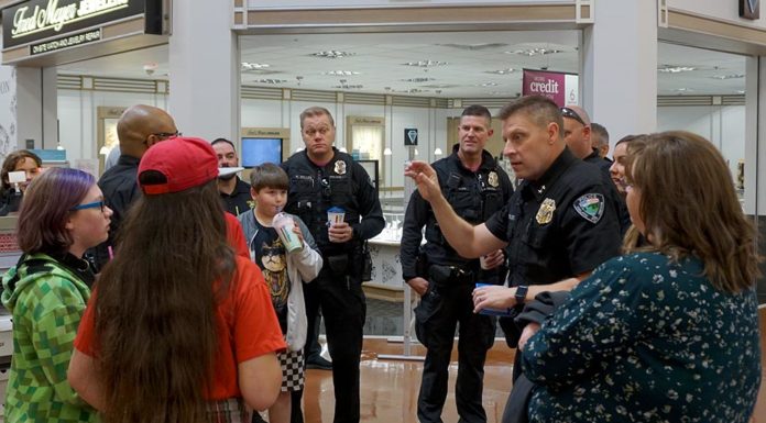 Students ‘Shop with a Cop’ for School Supplies at Fred Meyer