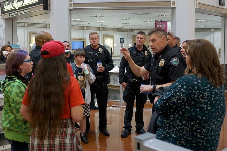 Students ‘Shop with a Cop’ for School Supplies at Fred Meyer
