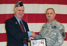 Tualatin VFW Moves to New Location Past Commander Dale Potts accepts certificate from SSG Anthony McDowell.