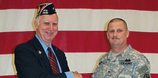 Tualatin VFW Moves to New Location Past Commander Dale Potts accepts certificate from SSG Anthony McDowell.