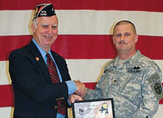 Tualatin VFW Moves to New Location Past Commander Dale Potts accepts certificate from SSG Anthony McDowell.