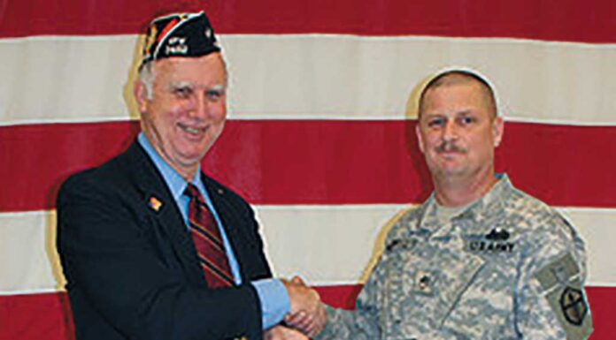 Tualatin VFW Moves to New Location Past Commander Dale Potts accepts certificate from SSG Anthony McDowell.