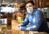 New law extends COVID tax credit for employers Man Wearing Mask