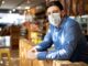 New law extends COVID tax credit for employers Man Wearing Mask