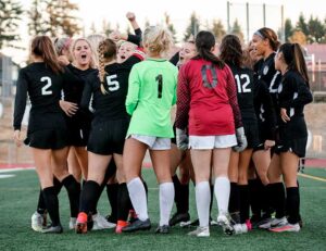 The Tualatin girls’ varsity soccer team rallies together to start off the 2-0 victory against South Eugene. 