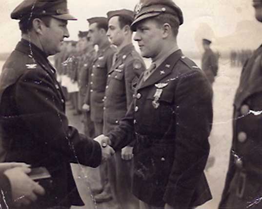 First Lieutenant Ray LeDoux receiving Distinguished Flying Cross for Cologne mission.