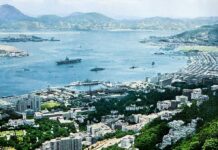 Most fondly remembered Western Pacific Memory for American sailors, for over a quarter century, Has been Mary Soo and her girls in Hong Kong Port 1957 picture of an aircraft carrier in Hong Kong.
