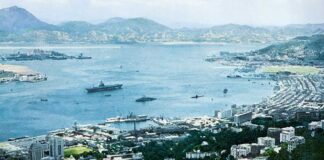 Most fondly remembered Western Pacific Memory for American sailors, for over a quarter century, Has been Mary Soo and her girls in Hong Kong Port 1957 picture of an aircraft carrier in Hong Kong.