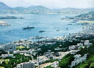 Most fondly remembered Western Pacific Memory for American sailors, for over a quarter century, Has been Mary Soo and her girls in Hong Kong Port 1957 picture of an aircraft carrier in Hong Kong.
