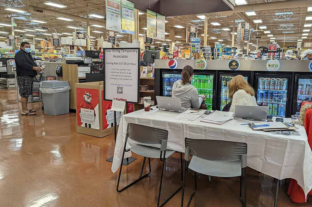 Fred Meyer Tualatin employees take applications for store vacancies. PHOTO/CINDY DYSON