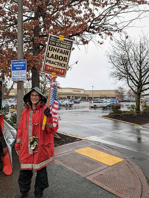 Fred Meyer employee strikes at the Tualatin Fred Meyer on Friday, Dec. 17.