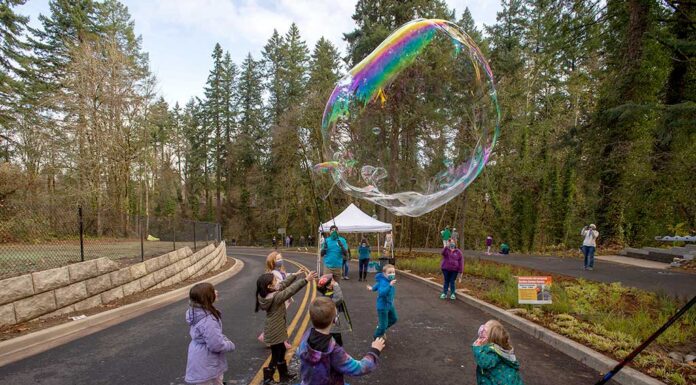 Tualatin CIO President’s Report: December 2021 Children play in the street during a Nov. 20 celebration of the Garden Corner Curves project.