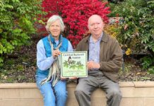 Tualatin Historical Society Garden wins award Chris Tunstall (left) and Larry McClure hold a metal plaque designating the historical society’s Backyard Habitat Silver Certification.