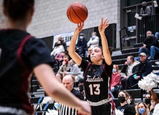 Timberwolves fire up basketball season with senior-less squad Anna Sherman (13) secures an opening and puts one up from three against Mountainside. Sherman scored the only three-pointer of the night from the Wolves in her five points scored.