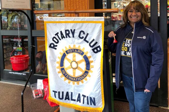 Tualatin Rotary’s Lisa Thorpe raising money for the Salvation Army’s Red Kettle Campaign.