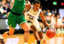 Tualatin gets its title! Tualatin’s Josiah Lake (14) squeezes by Summit’s Truman Teuber (3) for an early 4th quarter bucket.