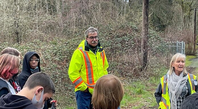 Tualatin’s Employee of the Year, Tom Steiger, loves life in the Parks Parks Maintenance Manager Tom Steiger (L) and Parks technician Shelly Helgerson (R) lead Hazelbrook Middle School students through a morning of planting in Jurgens Park