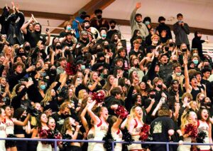 Celebrating the 66-49 State Championship win is the Tualatin Student Section and Cheerleading Squad.