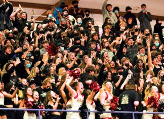 Opinion: Tualatin Basketball State Champions Celebrating the 66-49 State Championship win is the Tualatin Student Section and Cheerleading Squad.