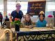 Dressed to Dream formalwear giveaway puts the glitz in prom for area teens Event organizer Cyndy Hillier (standing) joins volunteer greeters Keira Morthland (left) and Ellie Emery in welcoming guests to Dressed to Dream