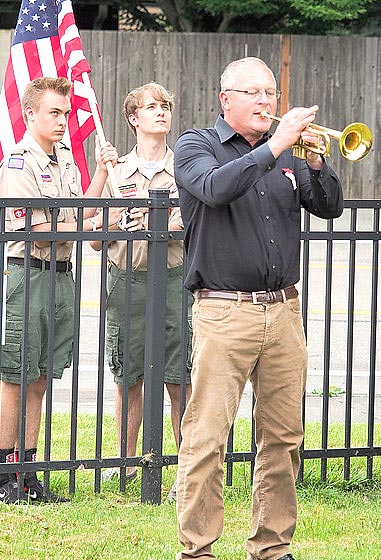 Bugler Martin Murrell with members of Boy Scout Troop 530.