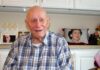 WWII veteran joined the Navy and saw the world Roland Whitely reminisces about his World War II experiences as a gunner on Merchant Marines ships transporting military supplies around the world. Behind him is a photo on a pillow of his beloved late wife of 71 years, Allene. Barbara Sherman/Tigard Life