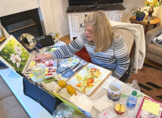 WOW! Local art group Wild Over Watercolor! still going strong Wild Over Watercolor member Karen Berg working on a painting at a WOW! meeting.