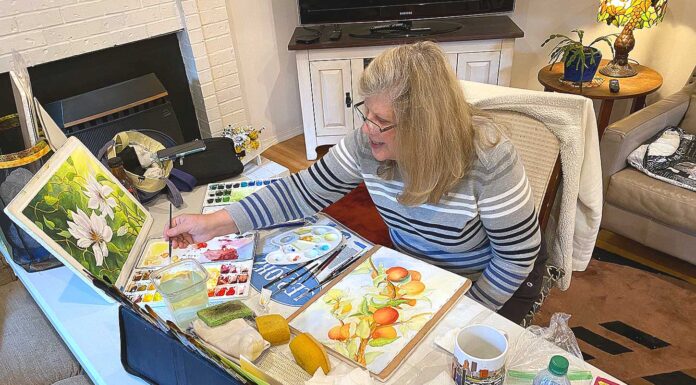 WOW! Local art group Wild Over Watercolor! still going strong Wild Over Watercolor member Karen Berg working on a painting at a WOW! meeting.