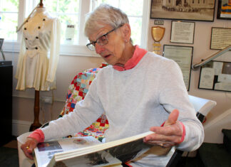 Modern-day pioneer walks in footsteps of great-great-great-grandparents on Oregon Trail At the Heritage Center, Barb Stinger looks through her scrapbook filled with photos, newspaper articles and mementos from her 1993 walk along the Oregon Trail.