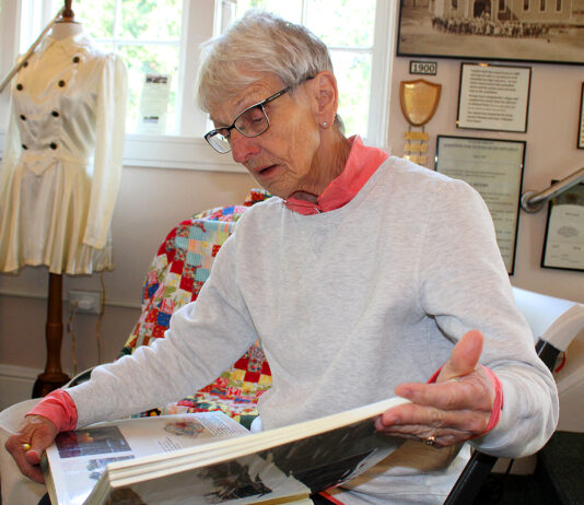 Modern-day pioneer walks in footsteps of great-great-great-grandparents on Oregon Trail At the Heritage Center, Barb Stinger looks through her scrapbook filled with photos, newspaper articles and mementos from her 1993 walk along the Oregon Trail.