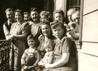 Holocaust survivor doesn’t hate Nazis, uses  education to teach against discrimination Eva’s family, last picture before Eva’s father was taken to forced labor camp. Eva is in front row, sitting on her mother’s lap, and her father is peeking out from the corner of the window. Eva never saw her father again after this day.