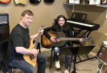 Tualatin Business Spotlight: King City Guitar Ben Rector (left) with student at King City Guitar.