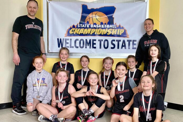 Coaches: Evan Johnson (left) and Kristin Mansfield. Players (L - R, top row) Harper Abernathy, Addison Evans, Clair Walson, Brielle Reist, Hailey DeClercque and Giavanna Mansfield; (Bottom row) Kendal Davidson, Reeve Johnson, Cora Lindsey and Riley Davidson.