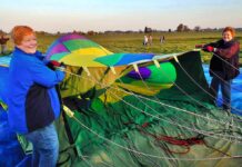 Taking Flight: Tigard Festival of Balloons seeks volunteers to keep event soaring Longtime balloon crew members Marilyn Barnhart (L) and Edie Stoaks hold the opening of a hot air balloon to assist in its inflation. Both women have volunteered on crew since the 1990s.