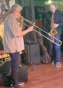 The horn section spills off the C.I.’s small stage, featuring Dick McPartland on trombone and Pete Moss on sax. 