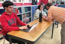 Intercambio: Finding Fellowship in School and Beyond Daniel works on an assignment in Intercambio while advisor Chris Lieuallen speaks to Mia.