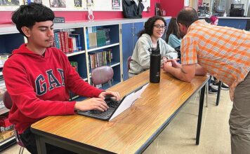 Intercambio: Finding Fellowship in School and Beyond Daniel works on an assignment in Intercambio while advisor Chris Lieuallen speaks to Mia.
