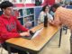 Intercambio: Finding Fellowship in School and Beyond Daniel works on an assignment in Intercambio while advisor Chris Lieuallen speaks to Mia.