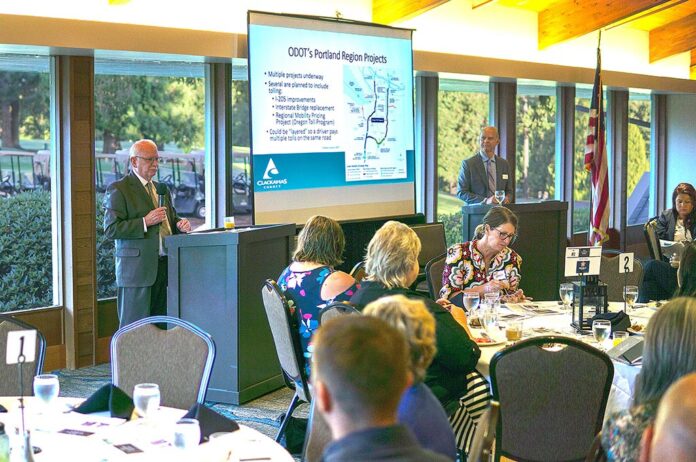 Washington County Commissioner Roy Rogers (left) and Clackamas County Commissioner Paul Savas (top right) discuss the plans and cons of a proposed I-205 tolling plan at last year’s Tualatin Chamber of Commerce Key Leaders Breakfast. File Photo/Tualatin Life