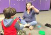 TTSD Makes Big Changes in Autism Services In this photo, Autism Specialist Val Valo uses play-based strategy to support the student’s social and language development. She encourage him to ask for the marbles in her hand as he builds a marble tower.