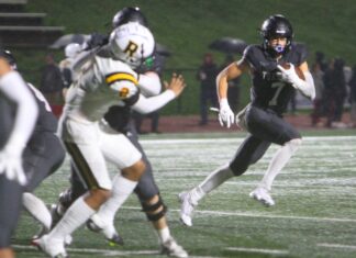 Tualatin cruises to first-round playoff win After filling in at quarterback for six games due to an injury, Tualatin's AJ Noland was back at receiver Friday night, and hauled in two touchdowns in a 49-3 win.