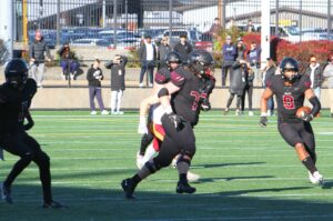 Jayden Fortier and the Tualatin offense were off to a hot start in the state title game, but the senior star ended up leaving in the second quarter with a knee injury as Tualatin lost 49-21 to Central Catholic.